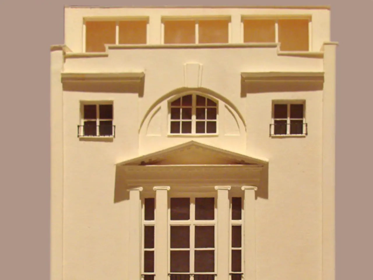 In this image I can see a building which has windows and doors.