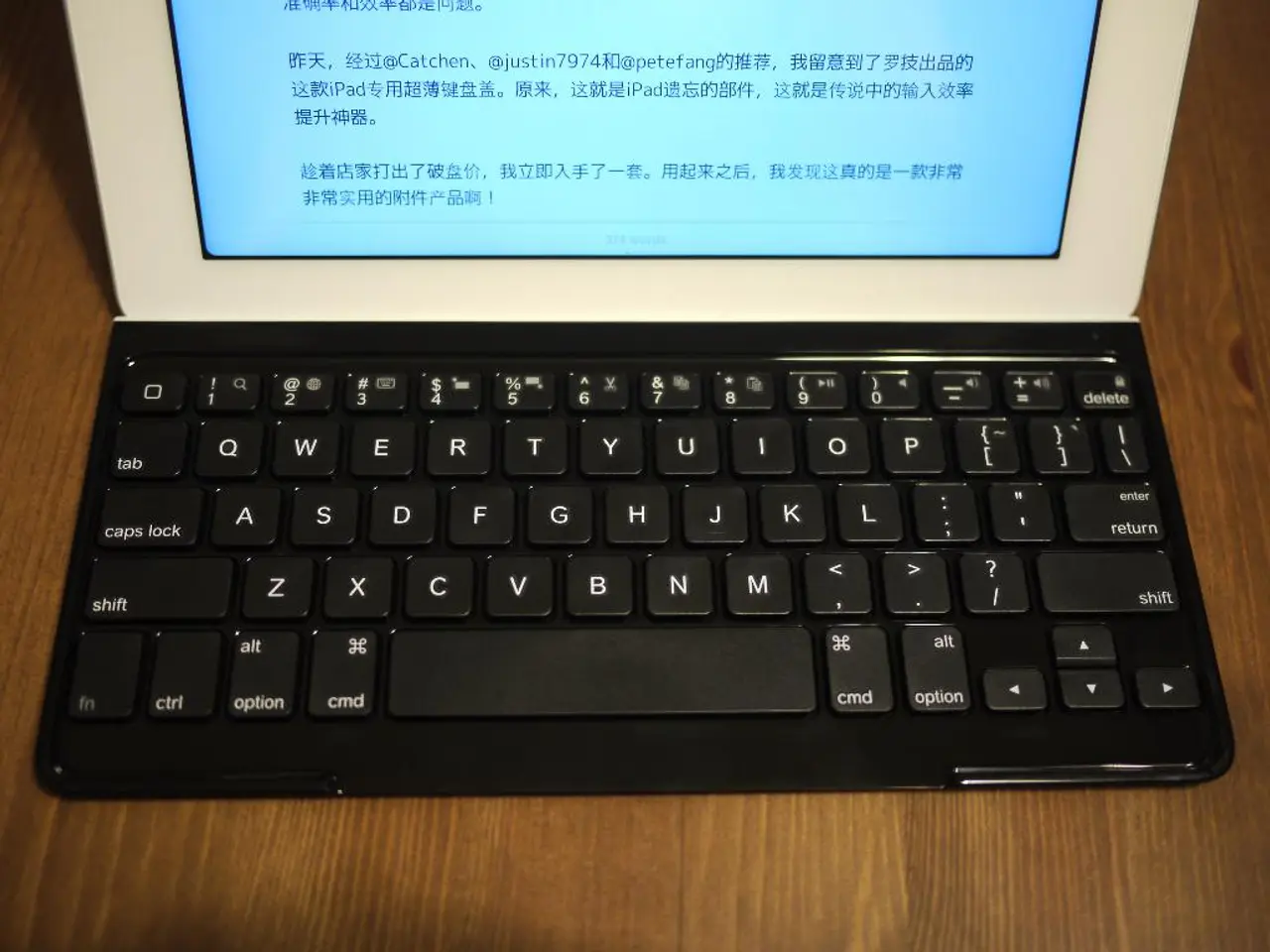 There is a laptop on a wooden surface.