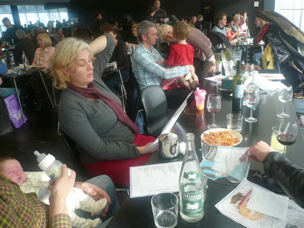 This is an inside view image of the restaurant where we can see there are so many people sitting on...