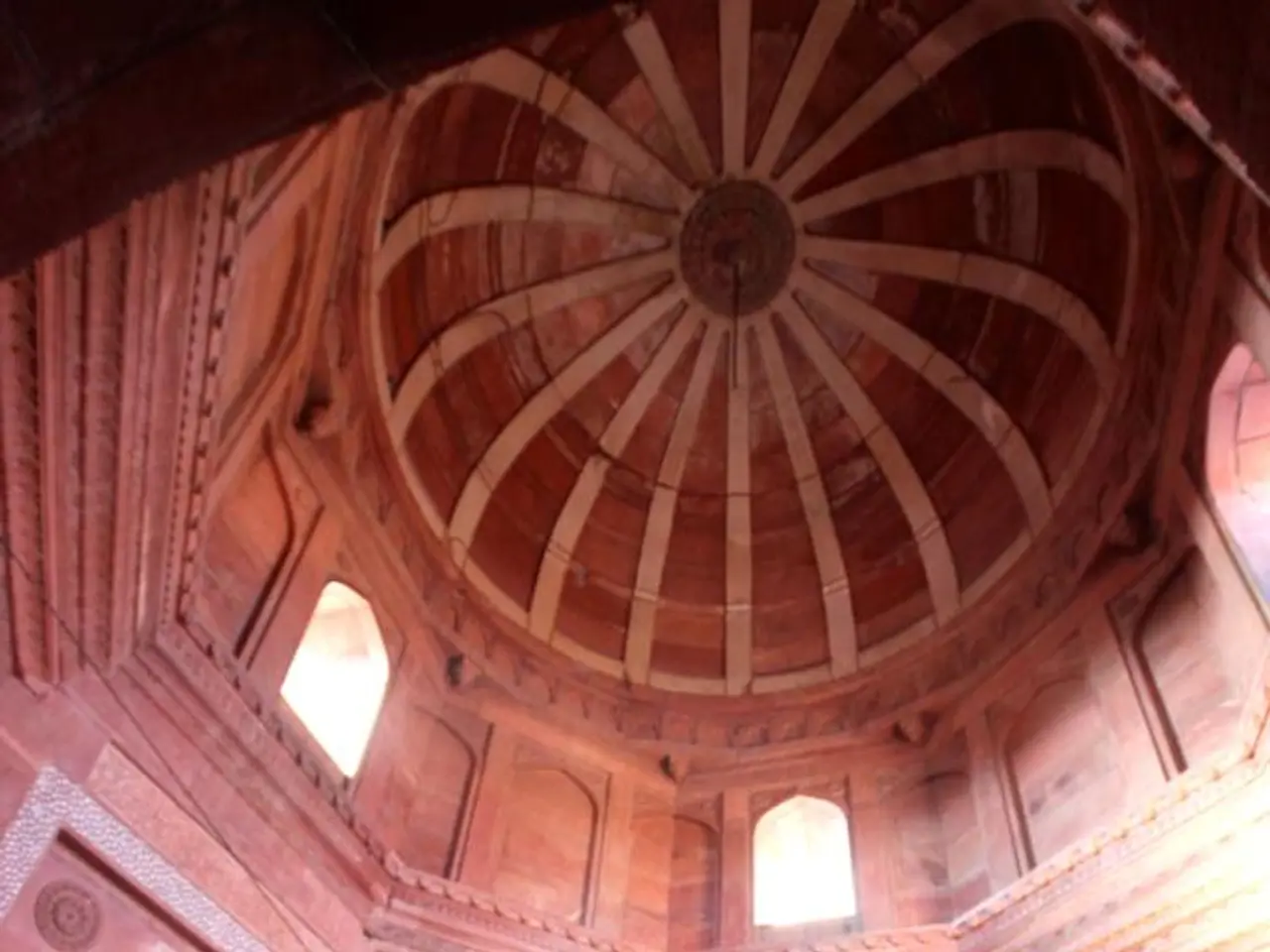 Here in this picture we can see an interior design of a monumental building and in the middle we...