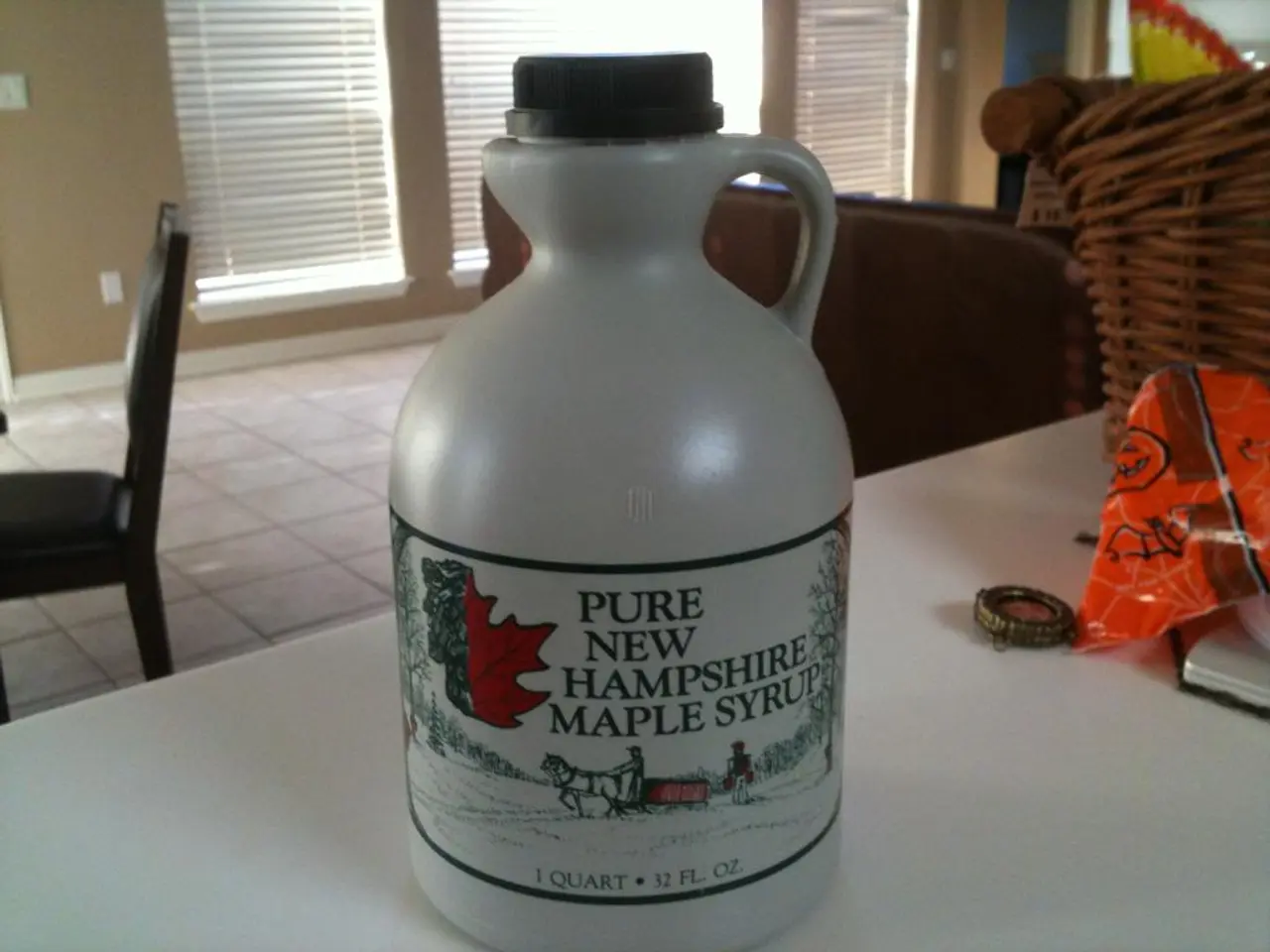 In this picture on the table there is a white bottle. On the right there is a plastic bag and...