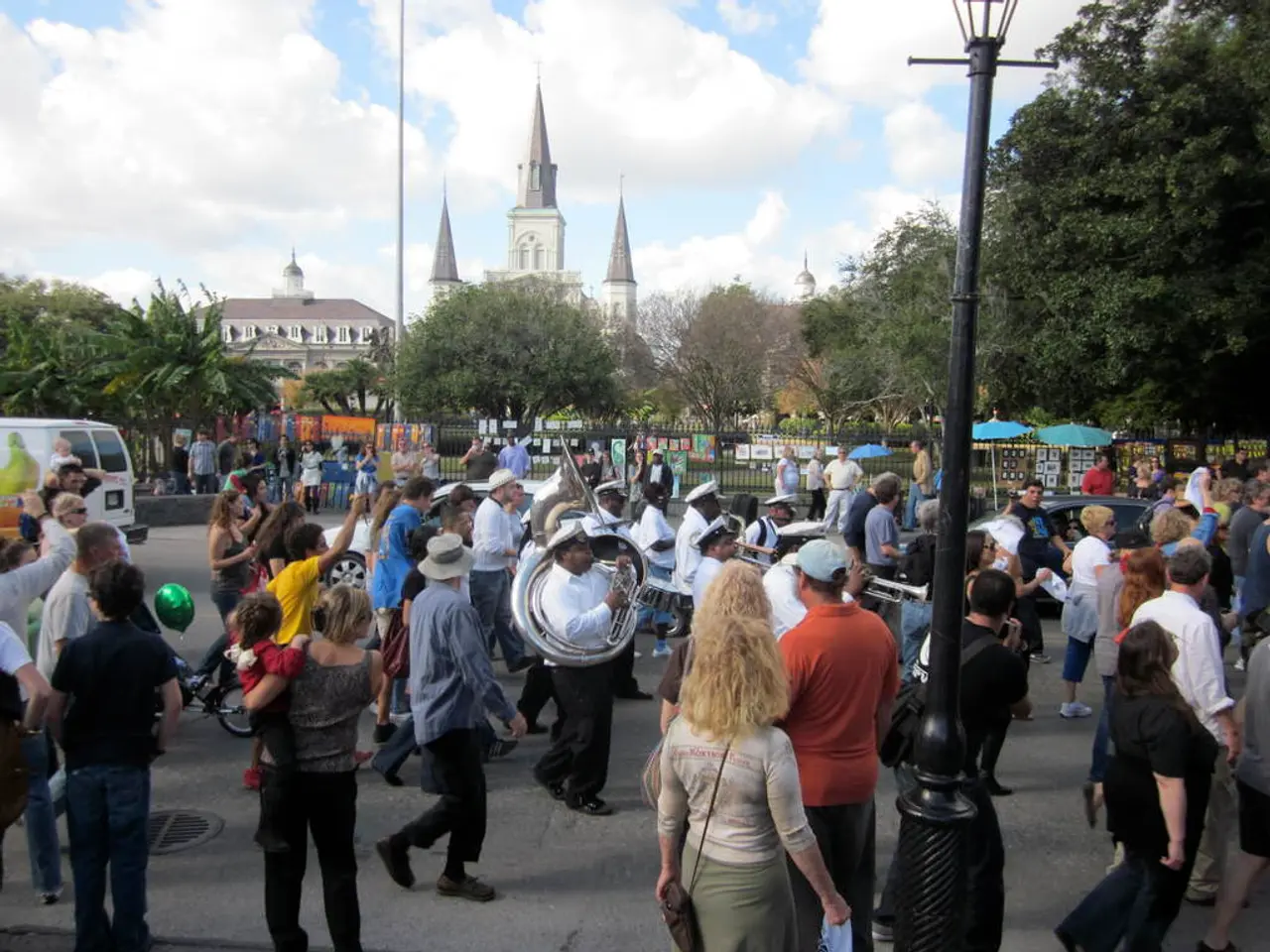 This is the picture of a place where we have some people on the road, among them some are playing...