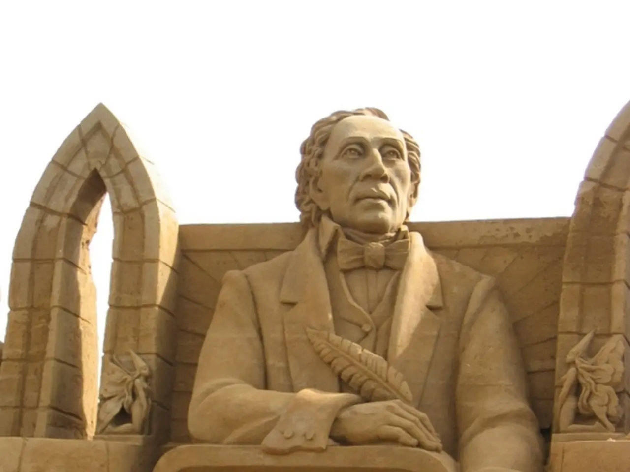 In this image there are some sculptures and a wall, and in the center there is some text.