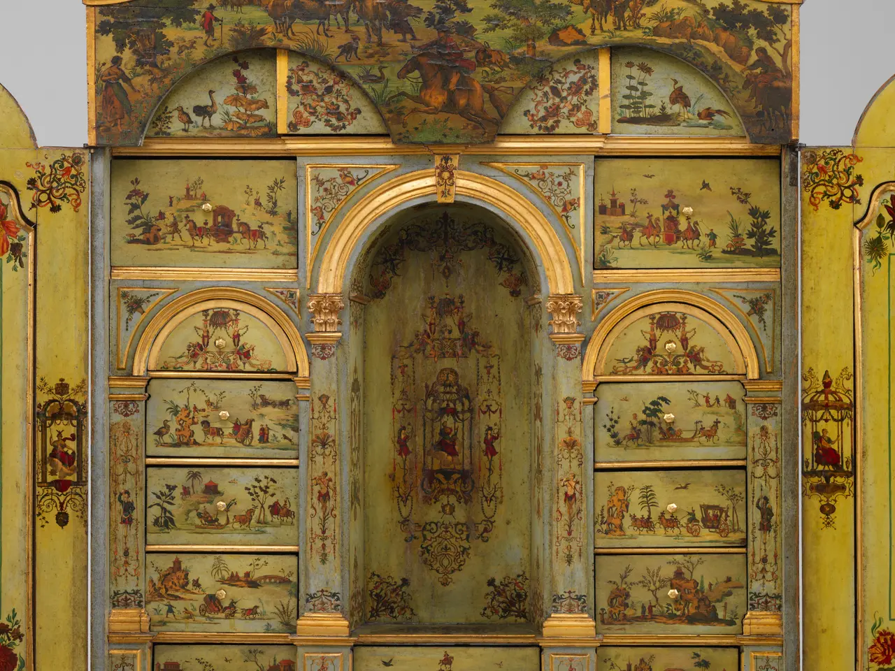 The image shows a painted cabinet with a floral design on it, set against a white background. The...