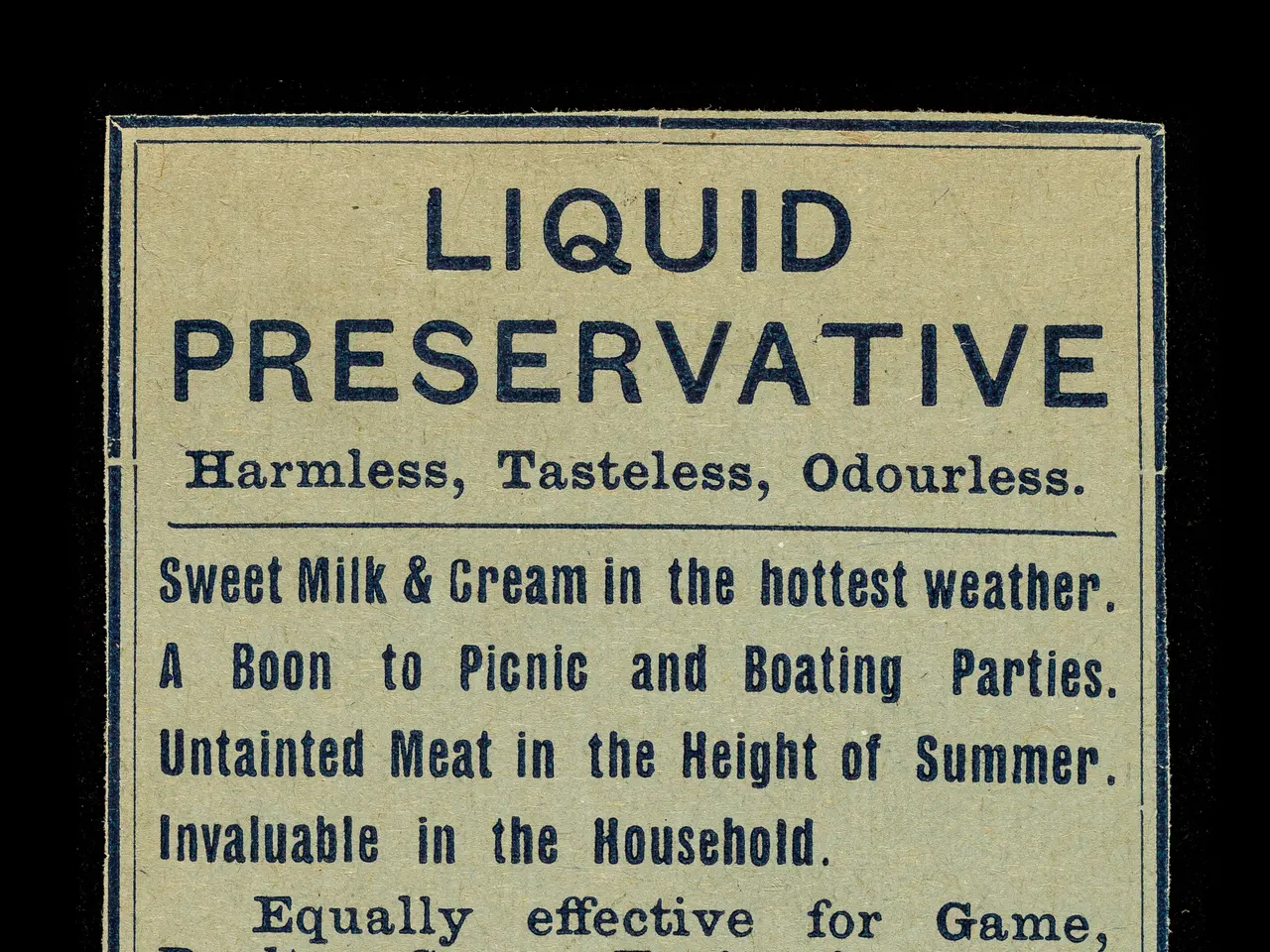 The image shows a black background with a paper in the center featuring text that reads "Liquid...