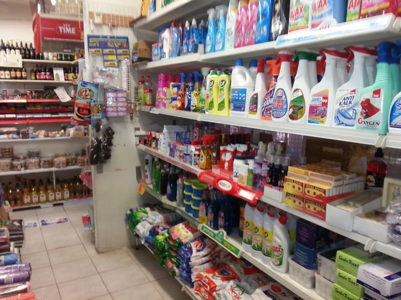 The image shows a store filled with lots of different types of cleaning products, including...