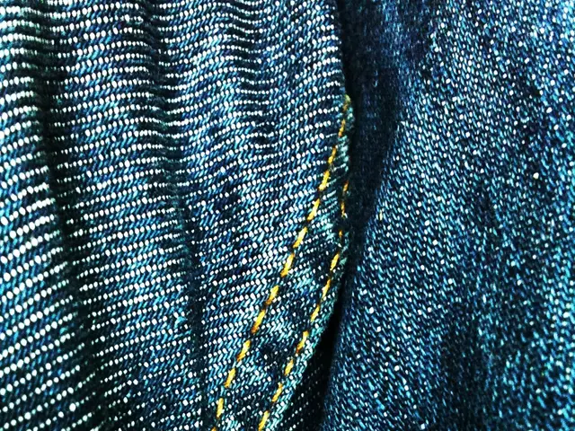 In this image we can see a blue color jeans cloth.