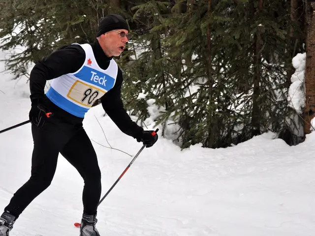 In this picture, there is a man skiing on the snow with skis and holding sticks and wore gloves and...