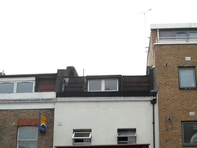 Here we can see buildings, glass windows and doors. On these buildings there are hoardings.