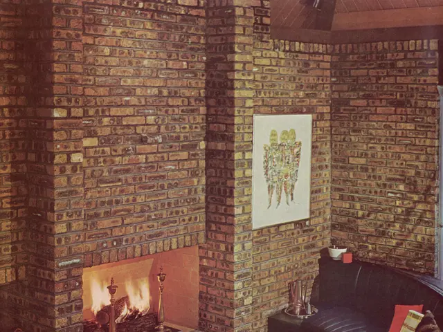 This picture shows the inner view of a building, one couch, one table with chairs, some objects on...