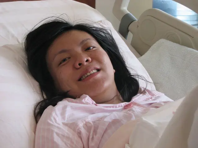 In this image, I can see a person smiling and lying on a bed. On the right side of the image, I can...