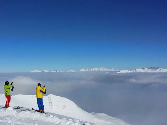 This picture is clicked outside the city. In the foreground we can see the two persons holding some...