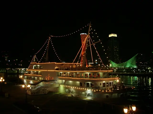 In this image there is a ship in the water, there are lightś on the ship, there is a pool, there...