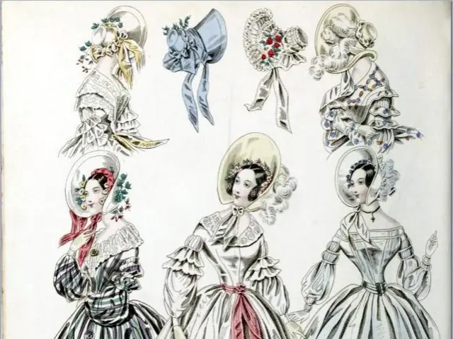 In this image we can see the pictures of women and hats on the paper. At the bottom of the image we...