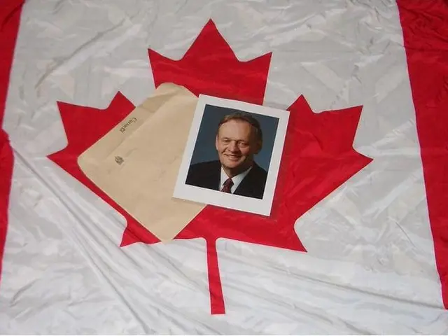 In this picture we can see photo and envelope on cloth.