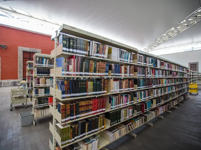 The image shows a large room filled with books on the racks, trolleys, a dustbin, a person sitting...