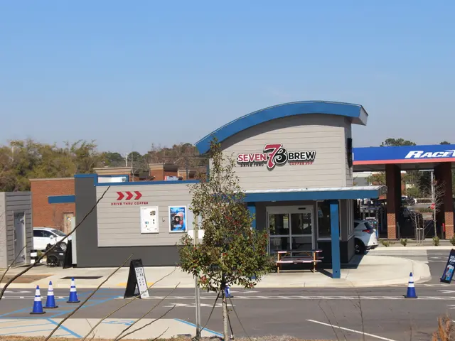 The image shows a 7-3-3 Brew Coffee Shop in Charlotte, North Carolina. There are vehicles on the...