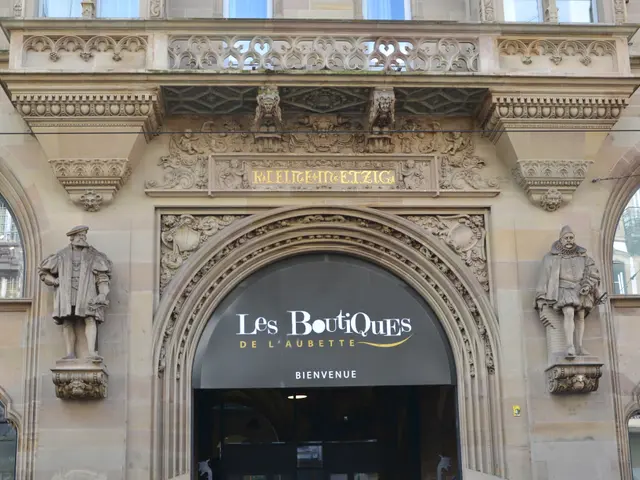 The image shows the entrance to Les Boutiques de l'Aubette in Paris, France. It is a building with...
