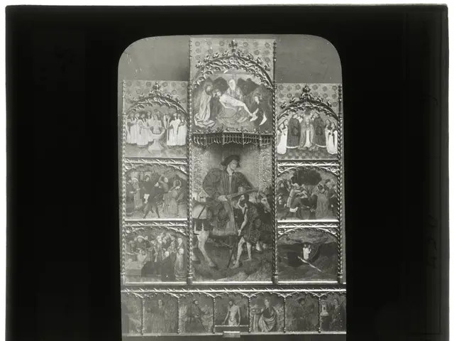 The image shows a black and white photo of a group of people in a room, with a photo frame in the...