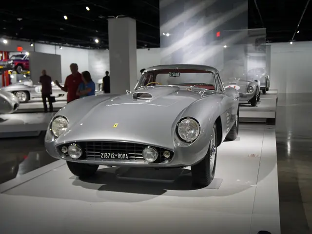The image shows a Ferrari 250 GT California Spyder on display at the Ferrari Museum in Rome, Italy....