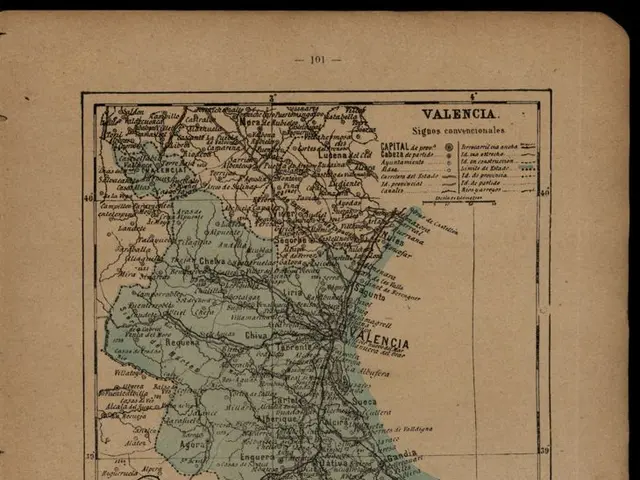 The image shows an old book with a map of Valencia, Spain on it. The map is detailed and shows the...
