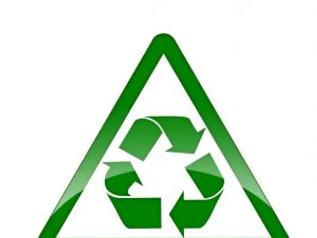 The image shows a green triangle with a white background and a green recycling symbol in the...