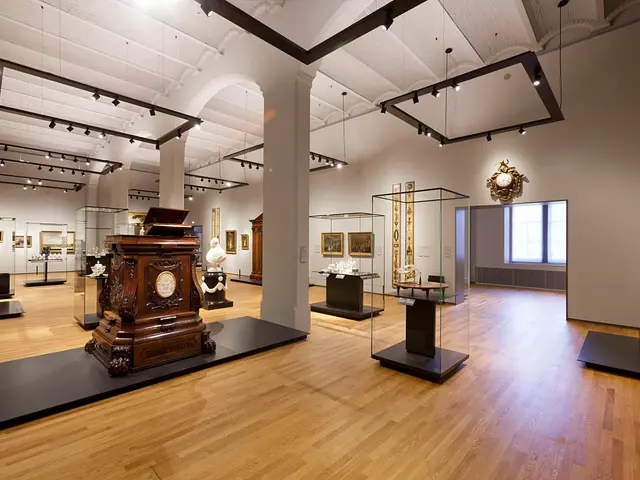 The image shows a large room filled with lots of different types of art, including sculptures,...