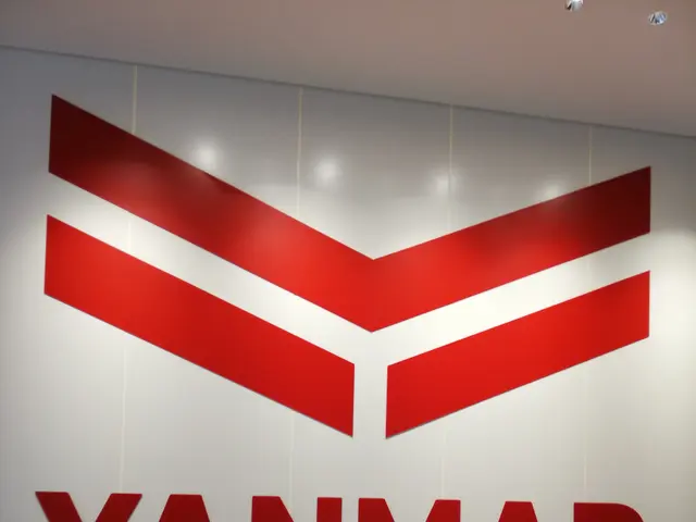 The image shows the Yanmar Museum in Singapore, with a logo and text on the wall, lights on the...