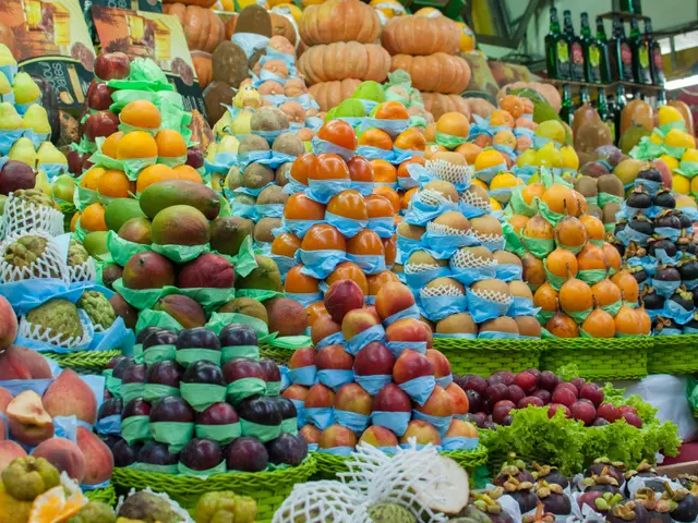 The image shows a market with a variety of fruits and vegetables on display, including apples,...