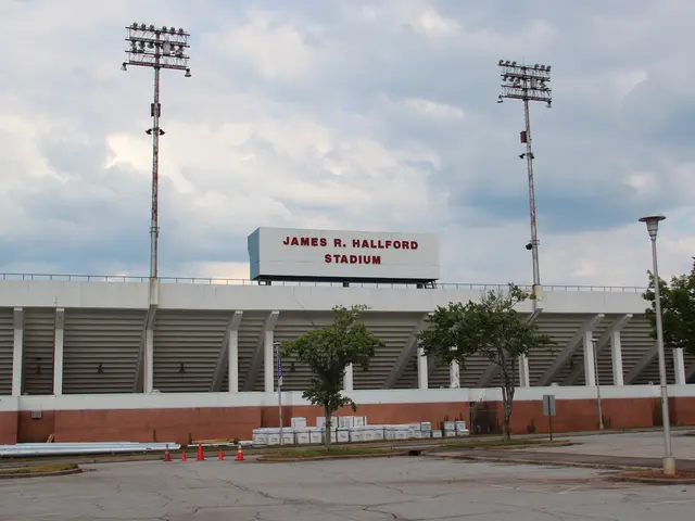 The image shows James R. Hallford Stadium in Houston, Texas. It is a large stadium with a name...