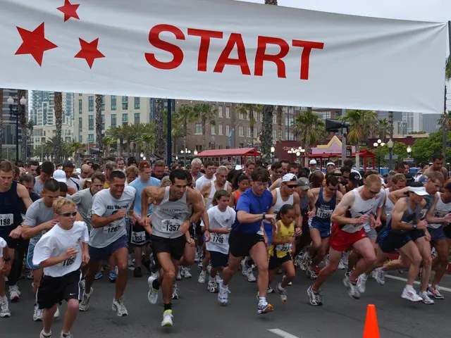 The image shows a group of people running in a marathon, with a traffic cone in the foreground and...