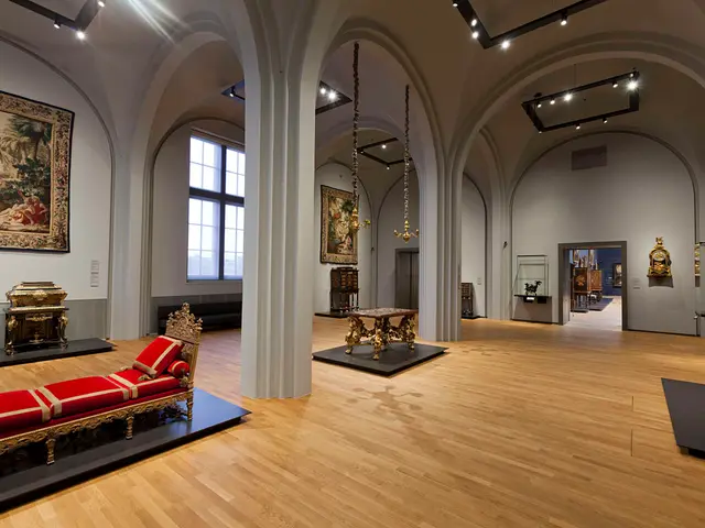 The image shows a large room filled with lots of furniture and paintings on the walls, including a...