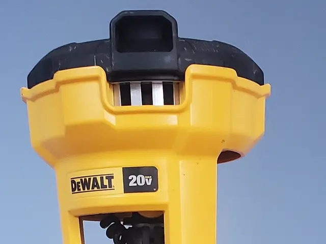 The image shows a yellow and black Dewalt 20V Max XR Li-ion Brushless Cordless Staple Gun on a...