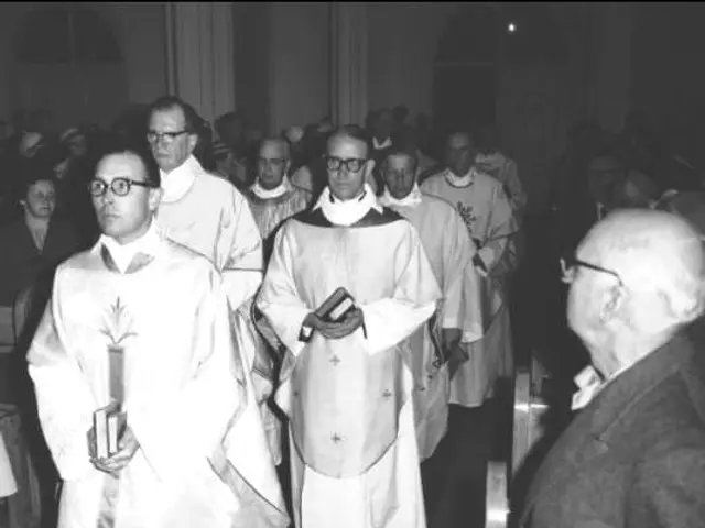 The image shows a group of men in priest's robes walking down a church aisle, with some of them...
