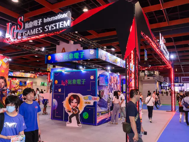 The image shows a group of people walking through a convention hall, some of them carrying bags and...