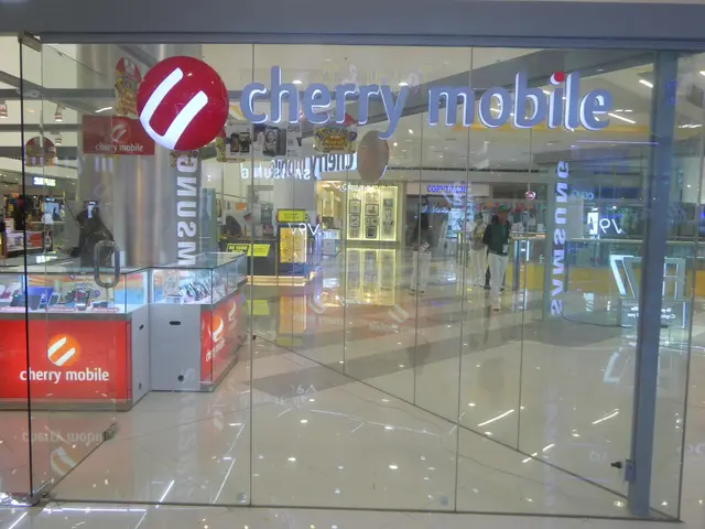 The image shows a cherry mobile store in the middle of a shopping mall, with glass walls and doors,...