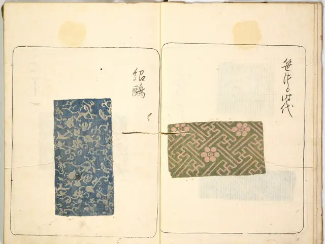 The image shows an open book with a blue and green design on it, set against a white background....