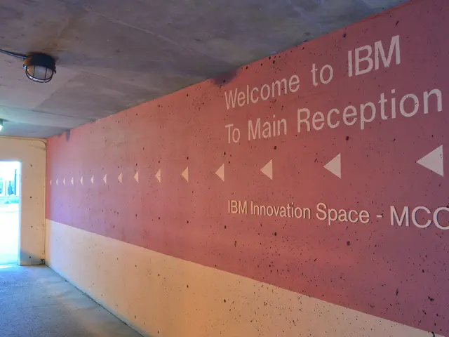 The image shows a wall with the words "Welcome to IBM" written on it, illuminated by lights from...