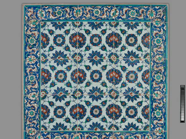 The image shows a blue and red tile with a floral design on it, set against a grey background. The...