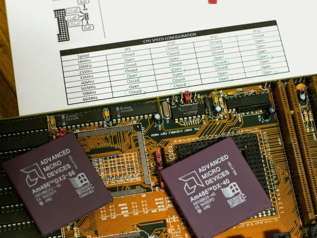 The image shows a close up of a computer motherboard with two chips on top of it, along with a...