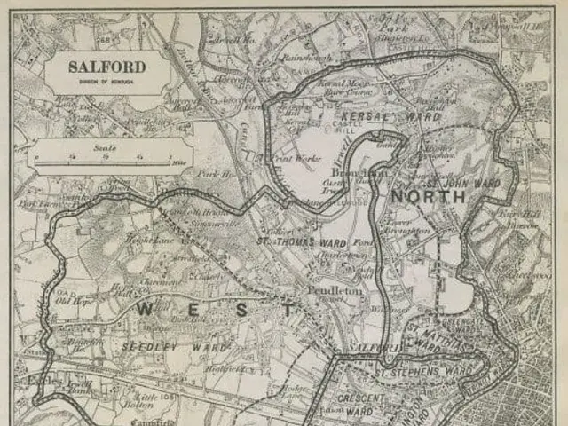 The image shows an old map of the city of Salford, England, with text written on it. The map is...