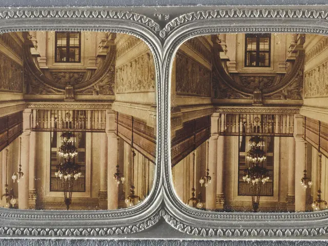 The image shows an old photo of a large room with chandeliers hanging from the ceiling, windows,...