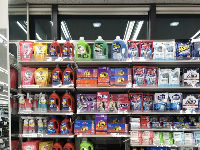 The image shows a refrigerator filled with lots of different types of cleaning products, such as...