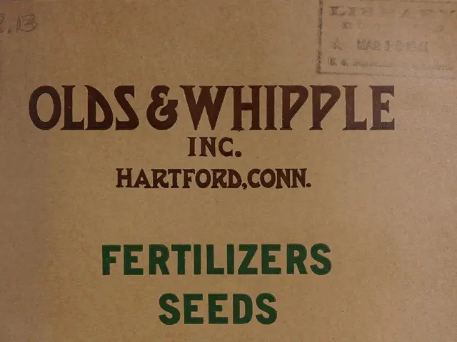 The image shows an old book with a picture of a plant on the cover page and text that reads...