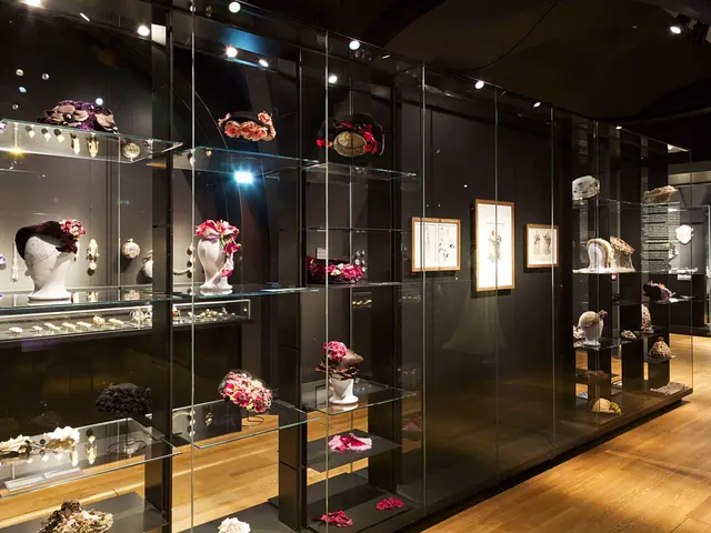 The image shows a room filled with glass shelves filled with a variety of jewelry, including...
