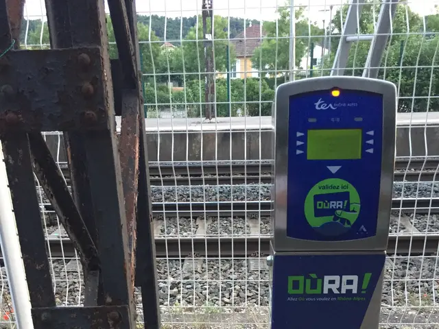 The image shows an electric vehicle charging station on the side of a road, with a metal object in...
