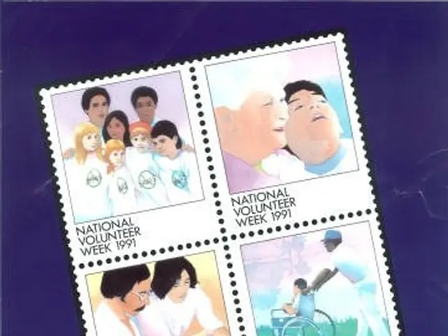 The image shows a poster with a group of people on it, with the words "Volunteer Put Your Stamp On...