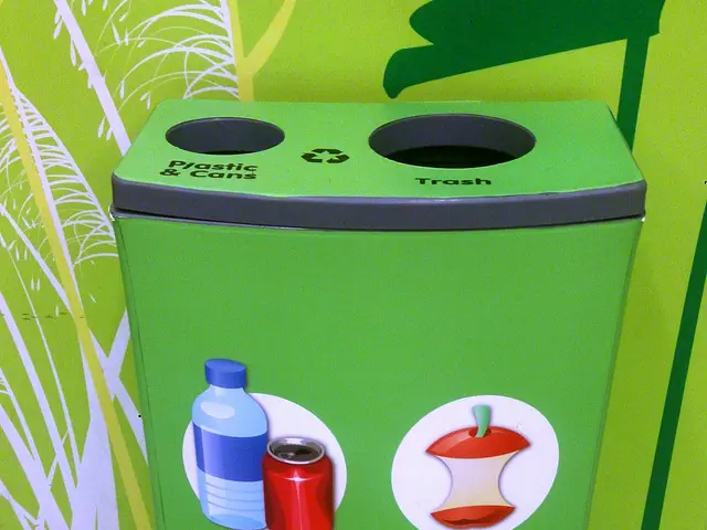 The image shows a green trash can sitting on top of a white floor, with a poster on the wall in the...