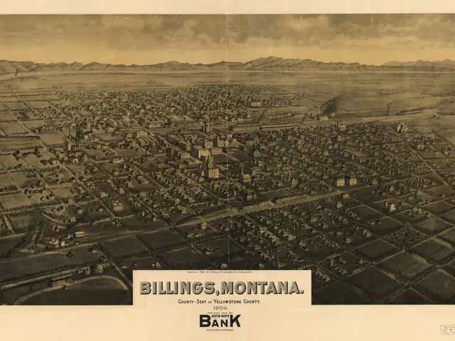 The image shows an aerial view of Billings, Montana, with buildings, trees, hills, and a sky in the...