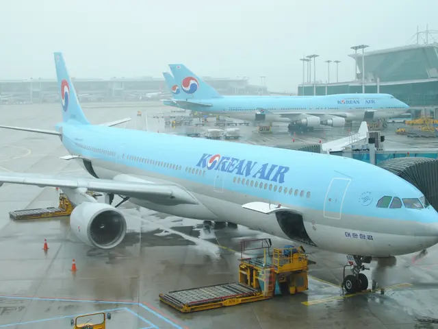 The image shows a Korean Air Boeing 777-300er at Beijing Capital International Airport, surrounded...